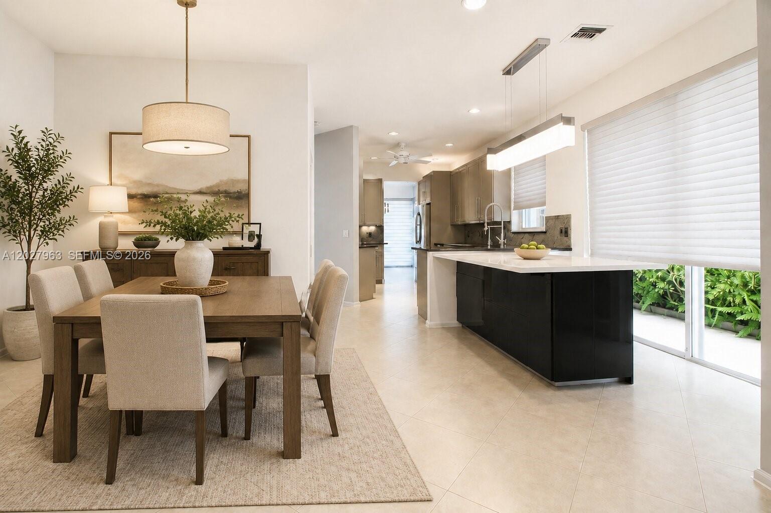 6646 Northwest 25th Terrace Boca Raton, FL 33496 - Photo 12 of 48 a dining room with furniture and window