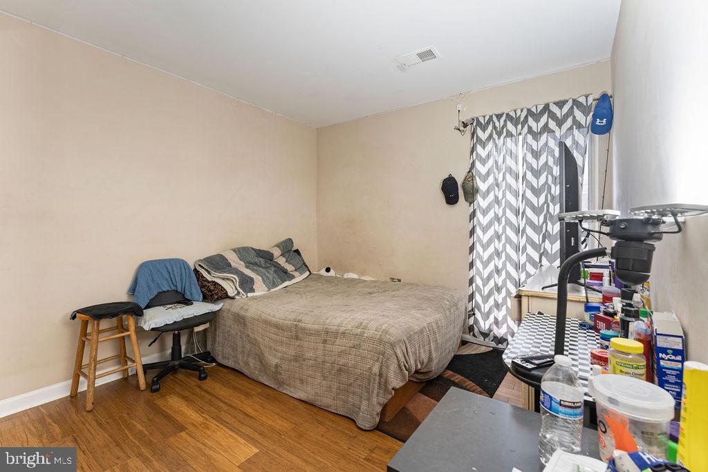 10805 Violet Court Manassas, VA 20109 - Photo 13 of 33 a bedroom with a bed and a window