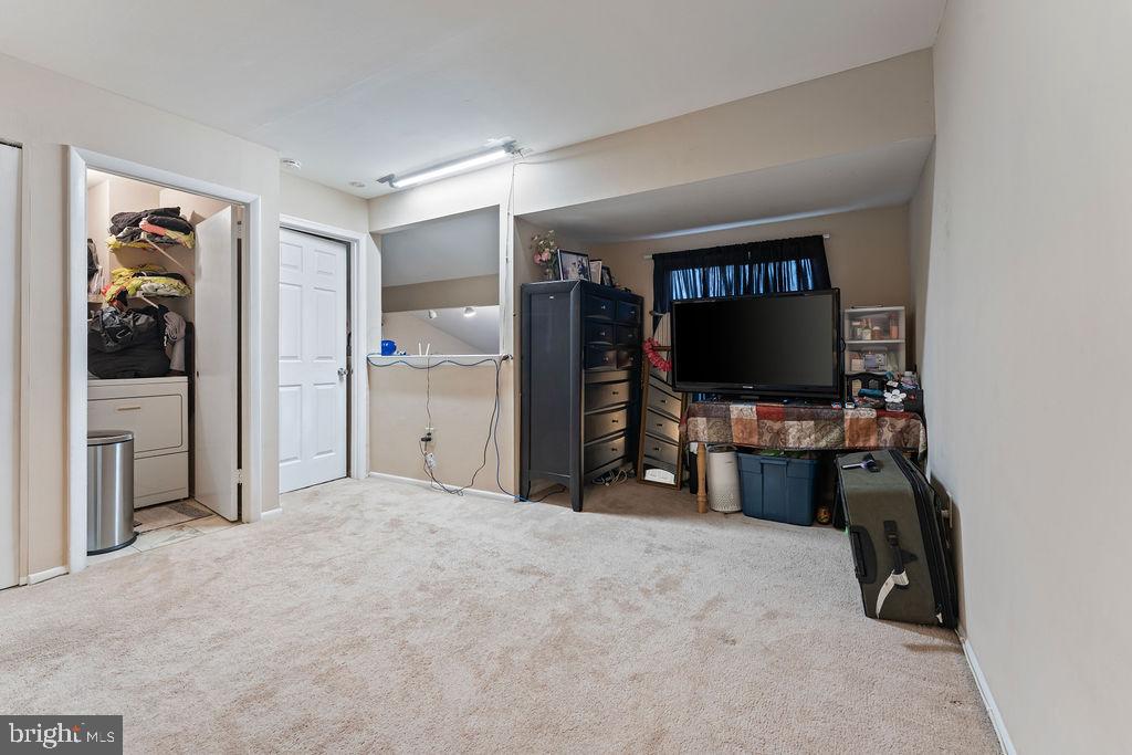 10805 Violet Court Manassas, VA 20109 - Photo 19 of 33 a view of a livingroom with furniture and a flat screen tv