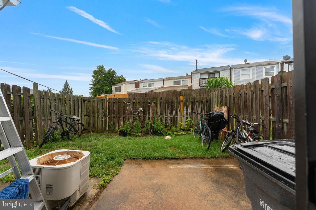 10805 Violet Court Manassas, VA 20109 - Photo 29 of 33 a view of a backyard with wooden fence