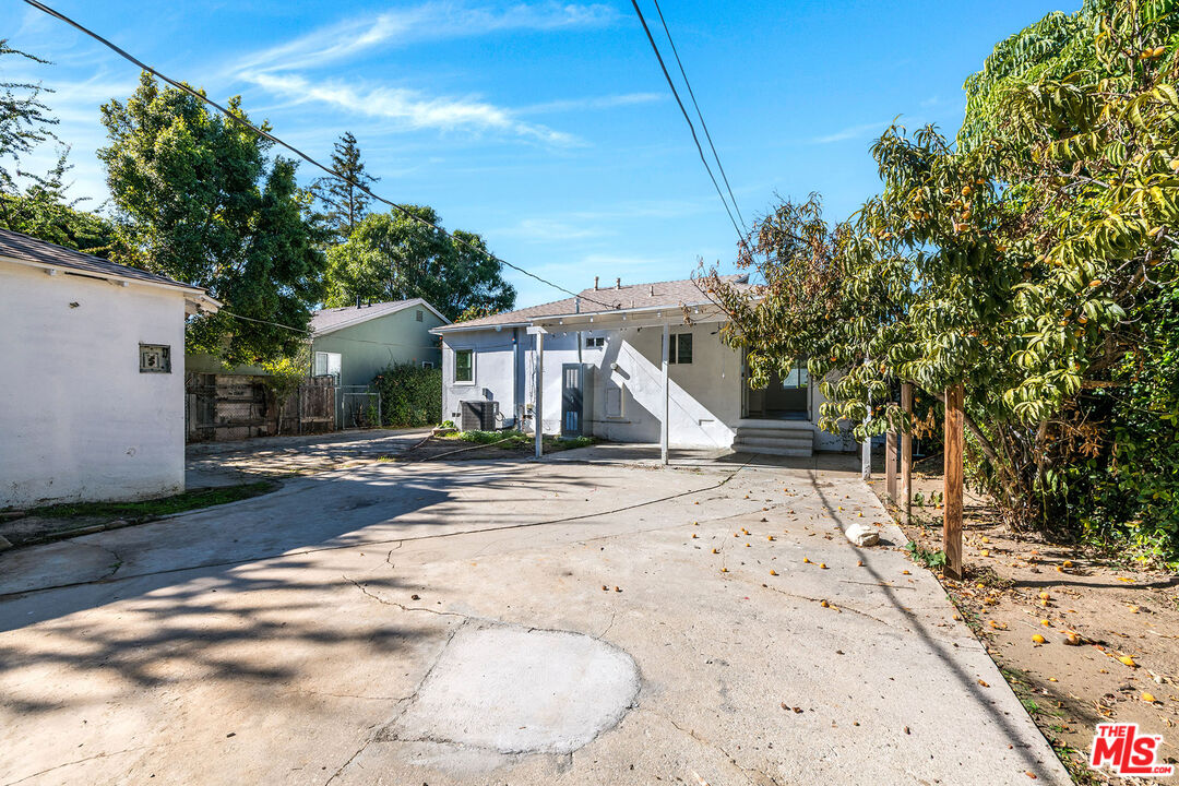 7422 Milwood Avenue Canoga Park, CA 91303 - Photo 13 of 15 a view of a house with a snow on the road