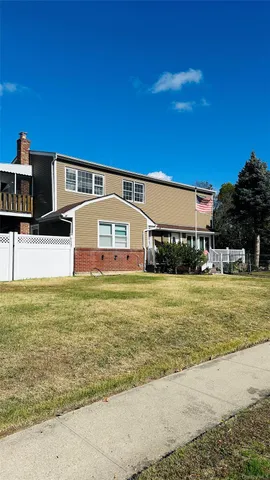 a front view of building with yard