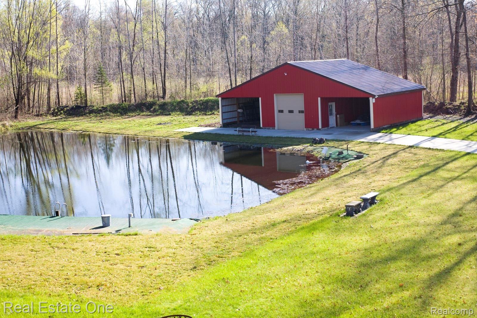 42560 Willis Road Belleville, MI 48111 - Photo 7 of 70 BEAUTIFUL POND AND HUGE 3 BAY POLE BARN. MIDDLE BAY IS CONDITIONED SPACE.