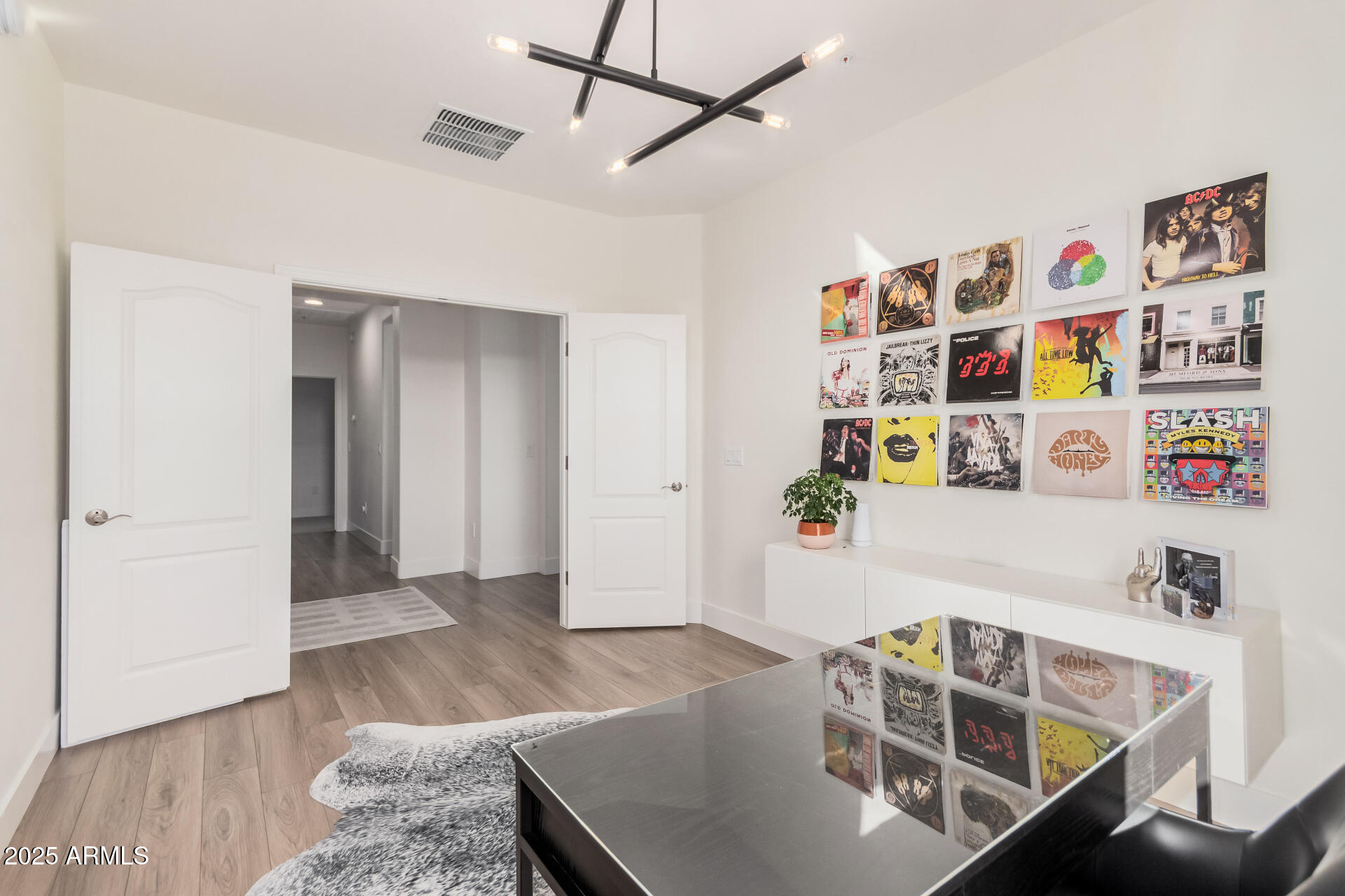 2425 West Bronco Butte Trail, Unit 2010 Phoenix, AZ 85085 - Photo 26 of 44 a living room with furniture and a wooden floor
