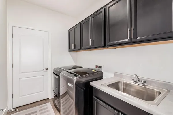 a kitchen with a sink and cabinets