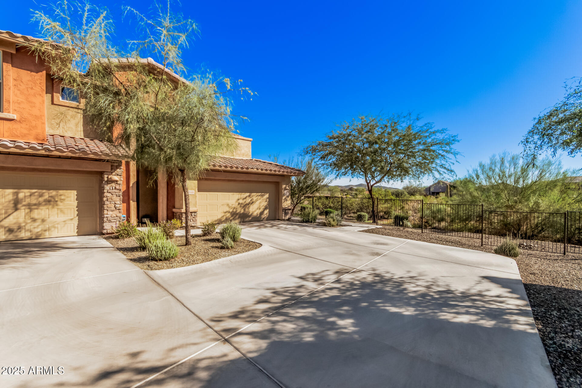 2425 West Bronco Butte Trail, Unit 2010 Phoenix, AZ 85085 - Photo 3 of 44 a view of a building with sitting area