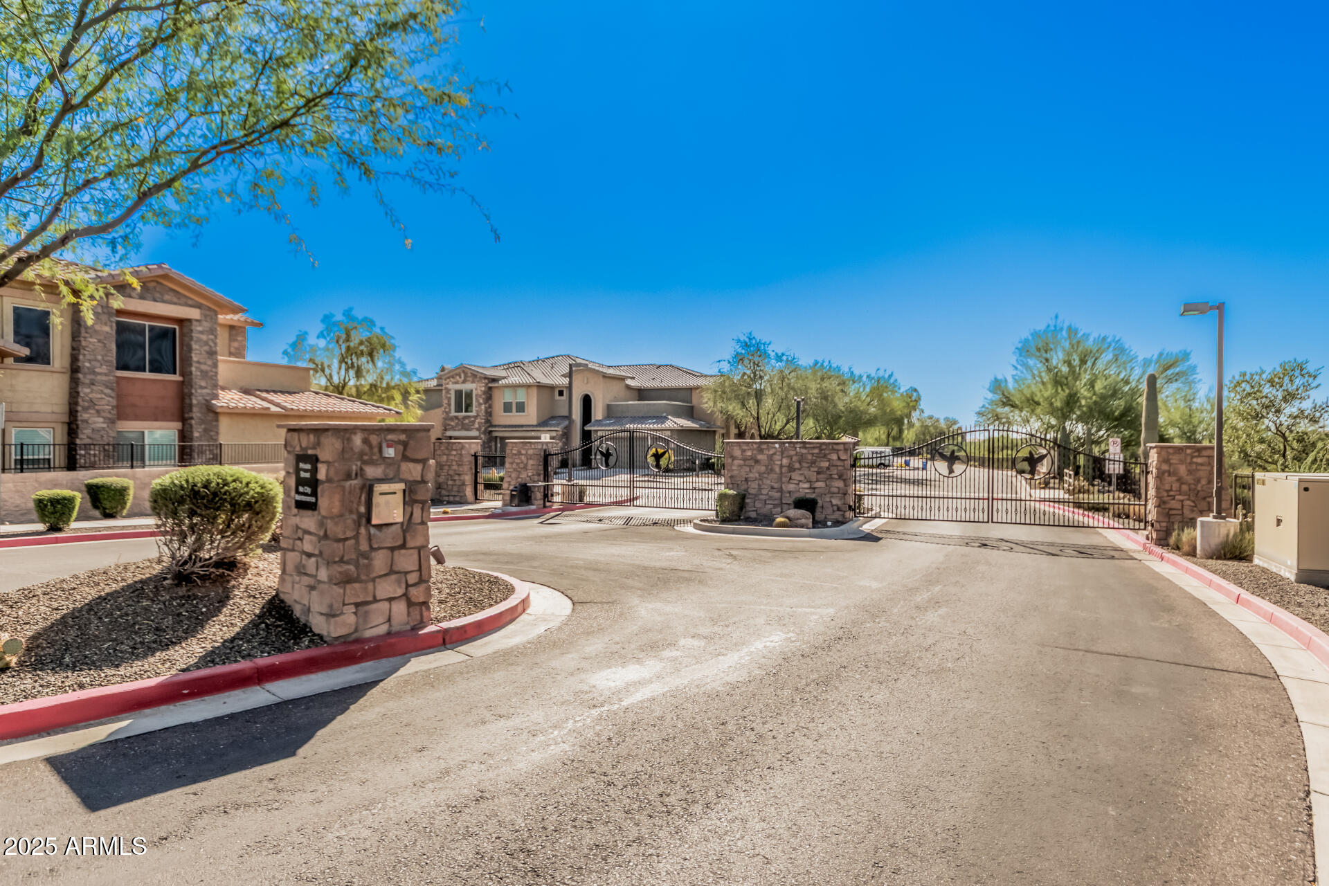 2425 West Bronco Butte Trail, Unit 2010 Phoenix, AZ 85085 - Photo 32 of 44 a view of a house with a patio