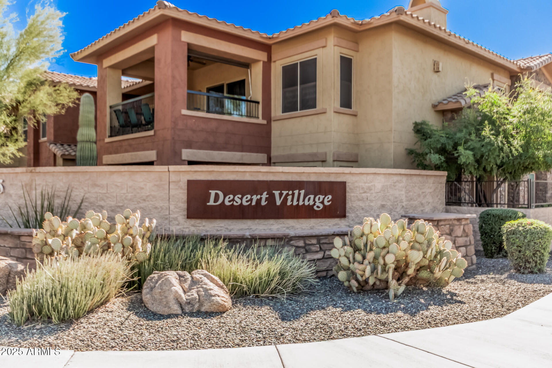 2425 West Bronco Butte Trail, Unit 2010 Phoenix, AZ 85085 - Photo 33 of 44 a sign on the side of a building