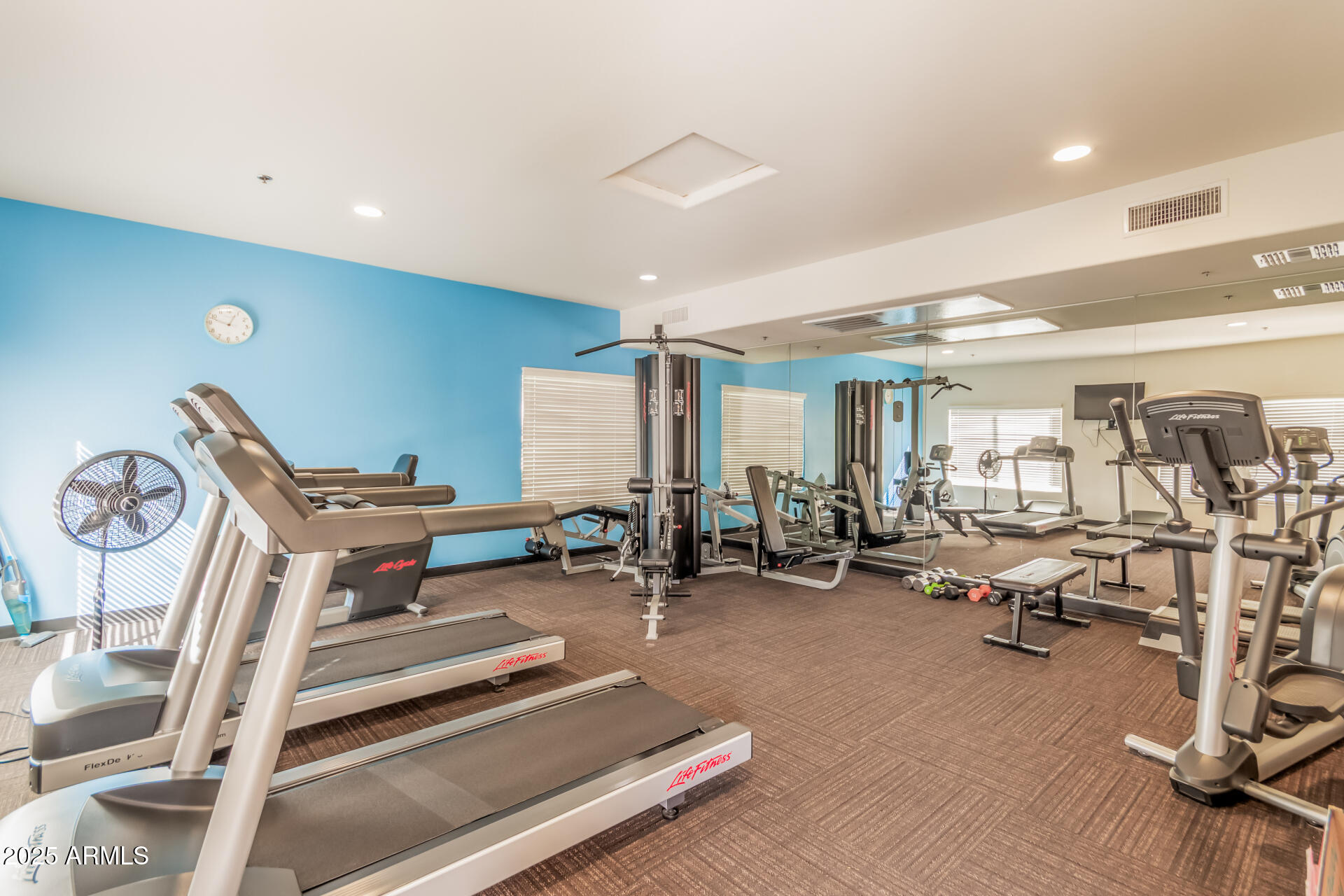2425 West Bronco Butte Trail, Unit 2010 Phoenix, AZ 85085 - Photo 34 of 44 a view of a room with gym equipment