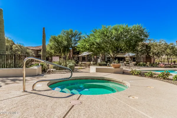 a view of a swimming pool with a patio