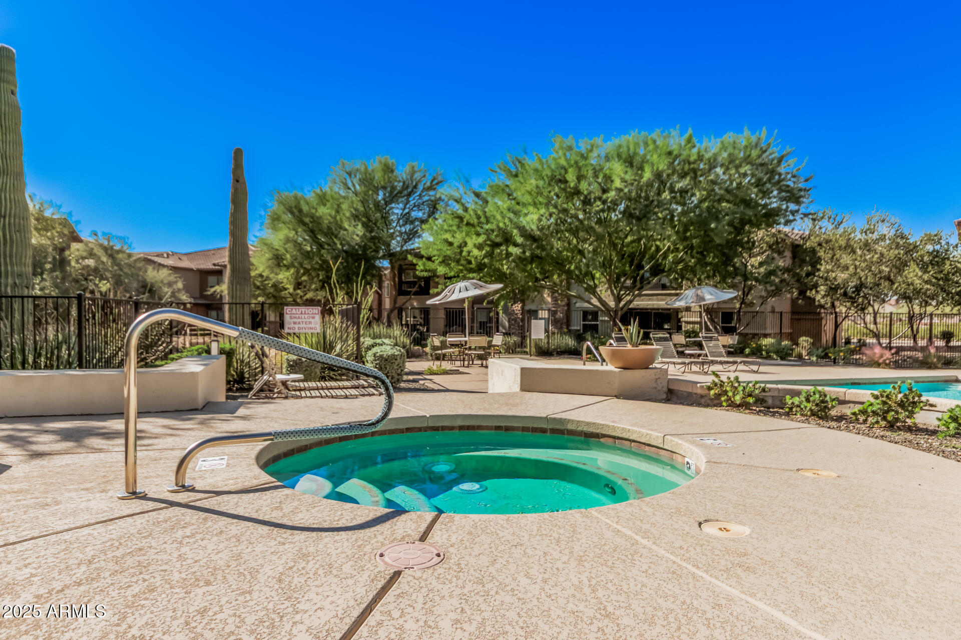 2425 West Bronco Butte Trail, Unit 2010 Phoenix, AZ 85085 - Photo 38 of 44 a view of a swimming pool with a patio
