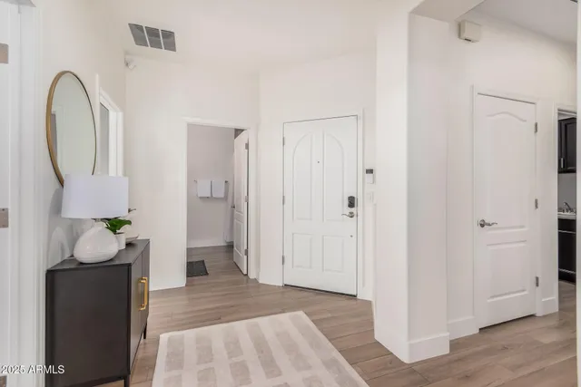 a view of an entryway with wooden floor
