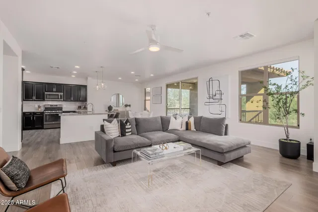 a living room with furniture and a large window