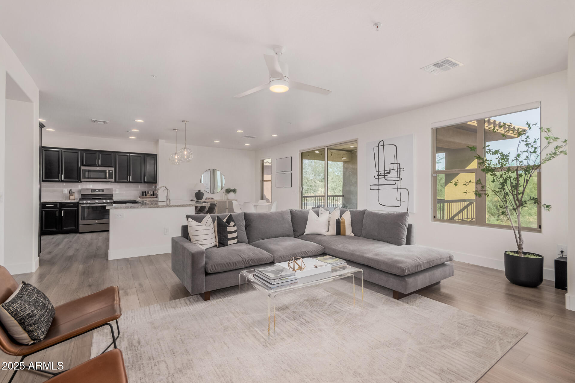 2425 West Bronco Butte Trail, Unit 2010 Phoenix, AZ 85085 - Photo 10 of 44 a living room with furniture and a large window