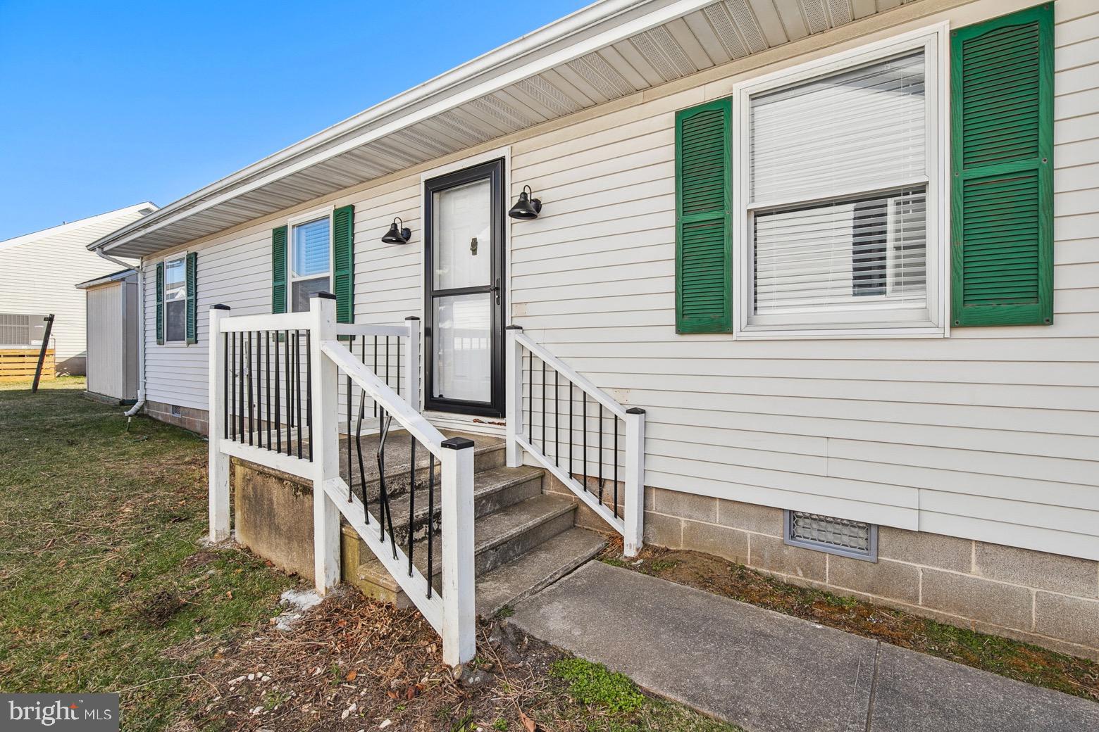 13700 Fiesta Road Ocean City, MD 21842 - Photo 24 of 31 a view of deck house with wooden floor and fence next to a yard