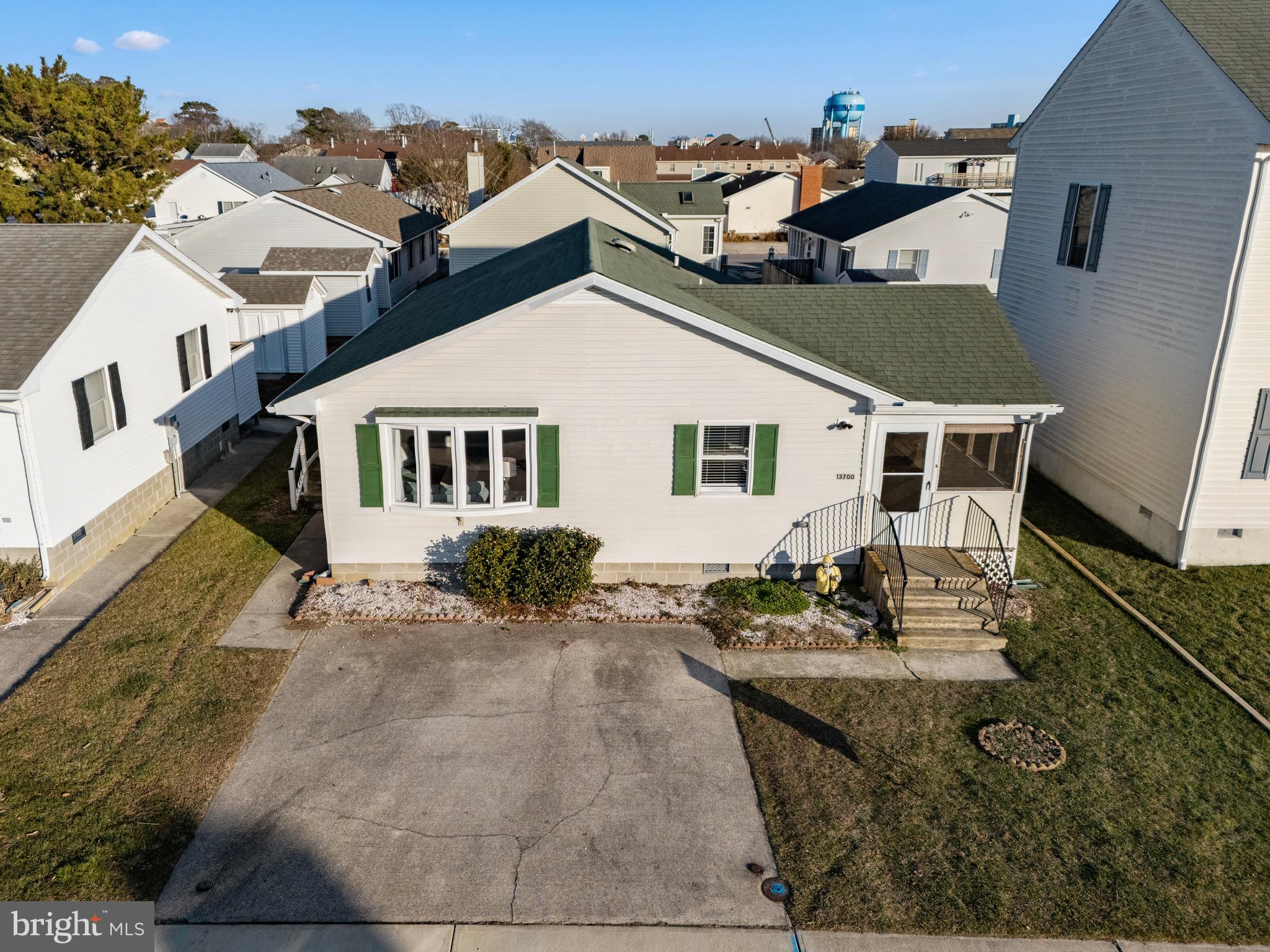 13700 Fiesta Road Ocean City, MD 21842 - Photo 30 of 31 front view of a house with a yard