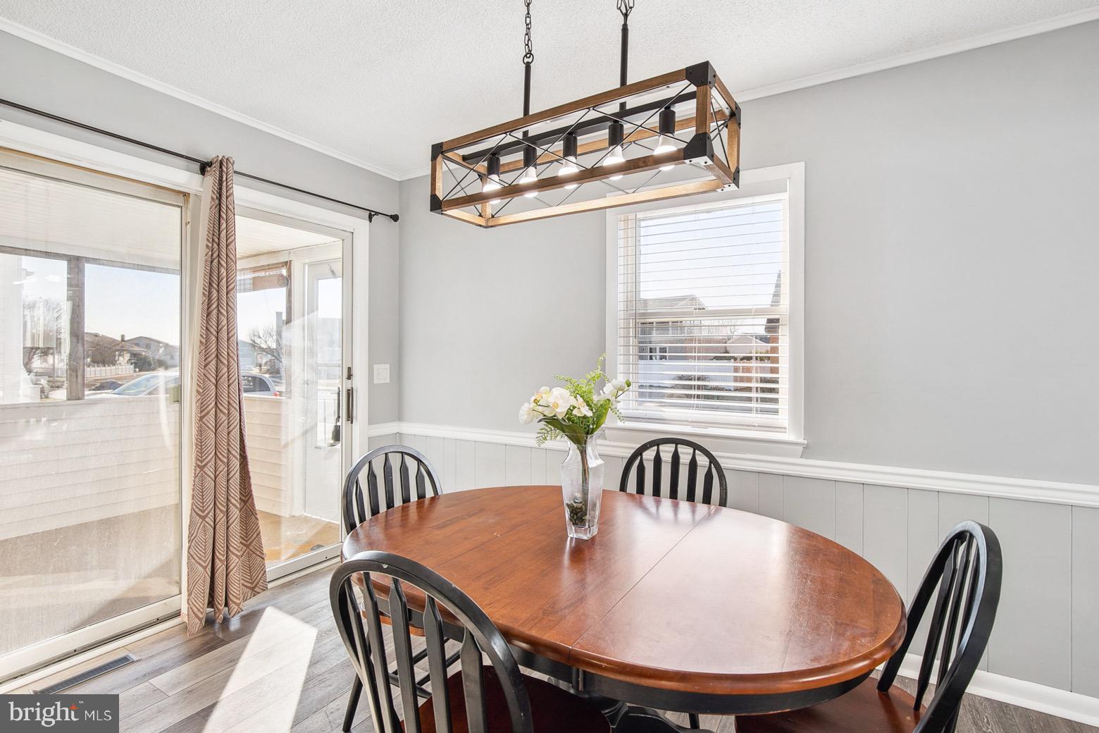 13700 Fiesta Road Ocean City, MD 21842 - Photo 9 of 31 a view of a dining room with furniture window and outside view