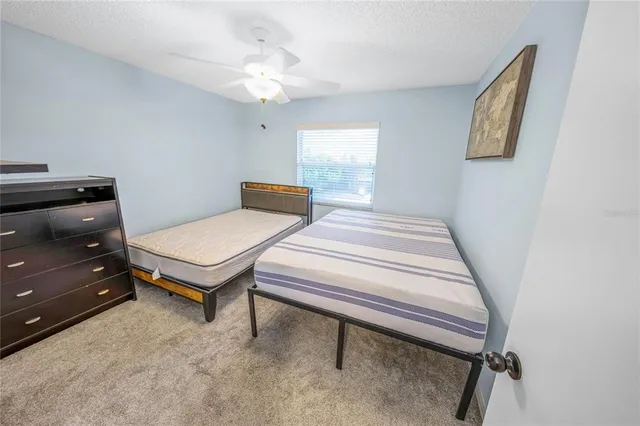 a bedroom with a bed and furniture