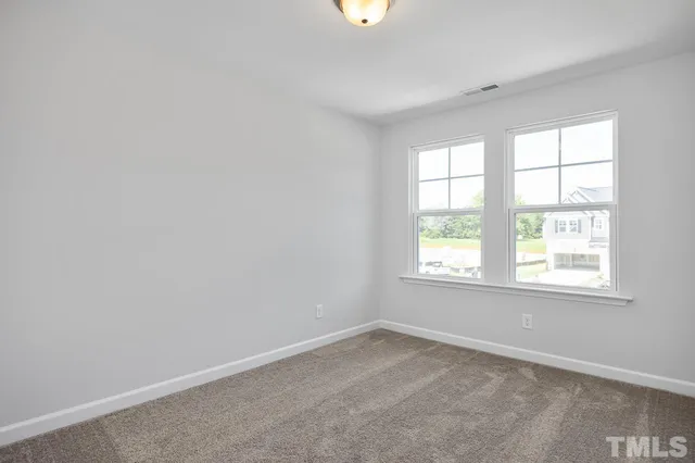 a black and white photo of a living room