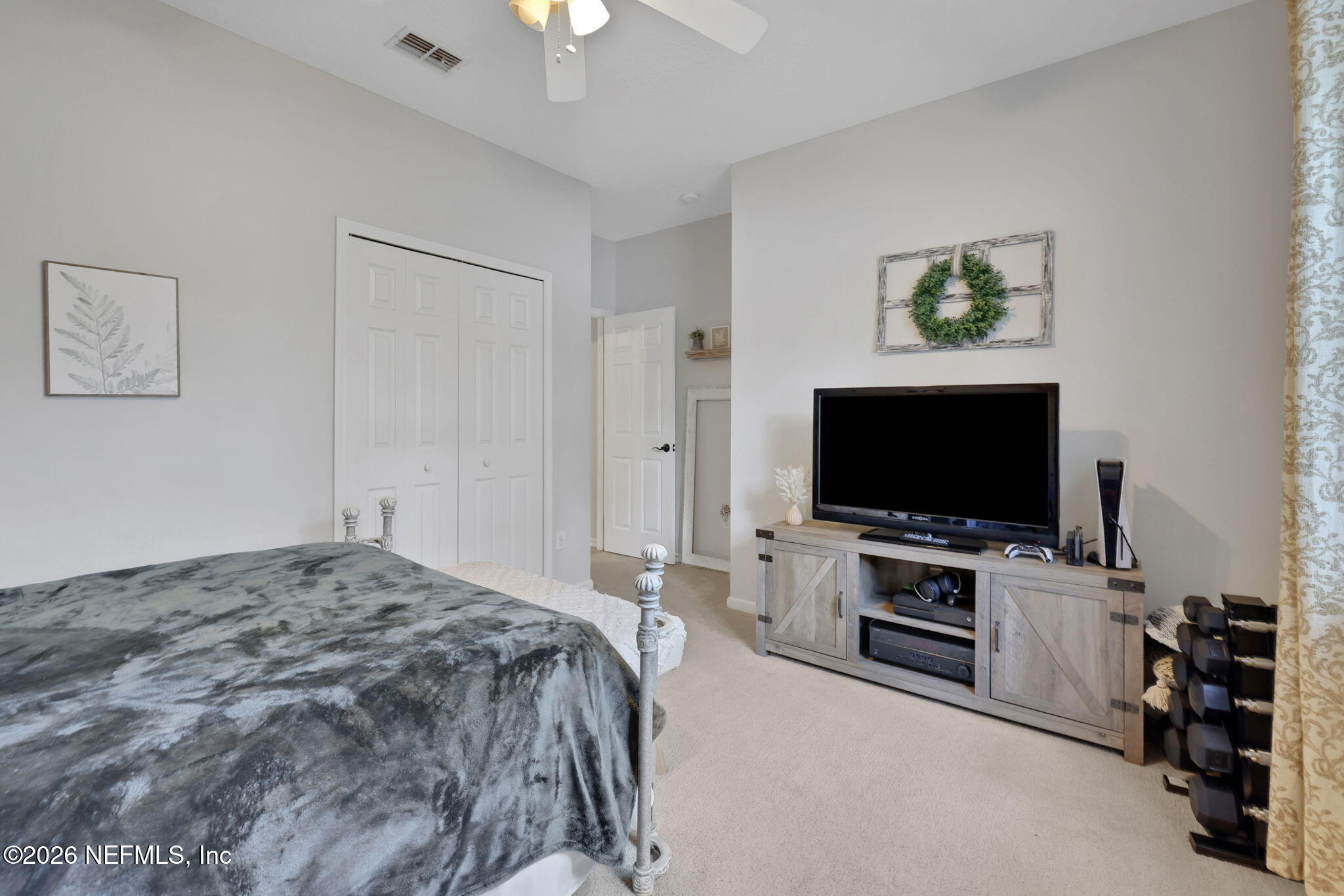 4320 Rye Court St. Johns, FL 32259 - Photo 44 of 60 a bedroom with a bed and a flat screen tv