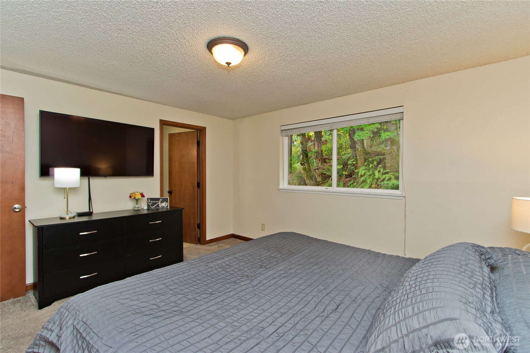 4237 South 326th Place Federal Way, WA 98001 - Photo 12 of 24 a bedroom with a bed and a flat screen tv