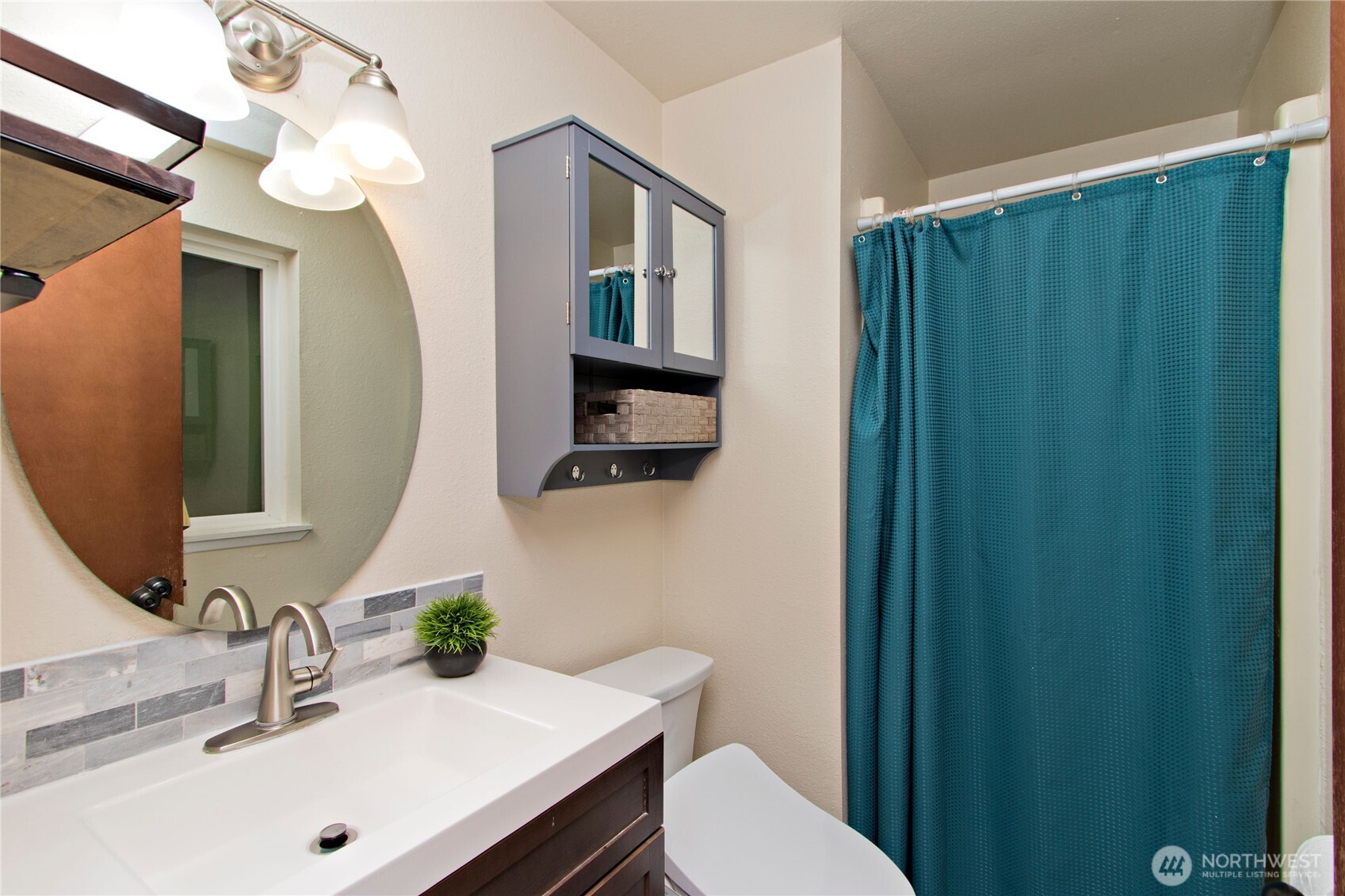 4237 South 326th Place Federal Way, WA 98001 - Photo 13 of 24 a bathroom with a sink a toilet and mirror