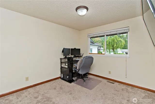 a bedroom with bed and a fireplace