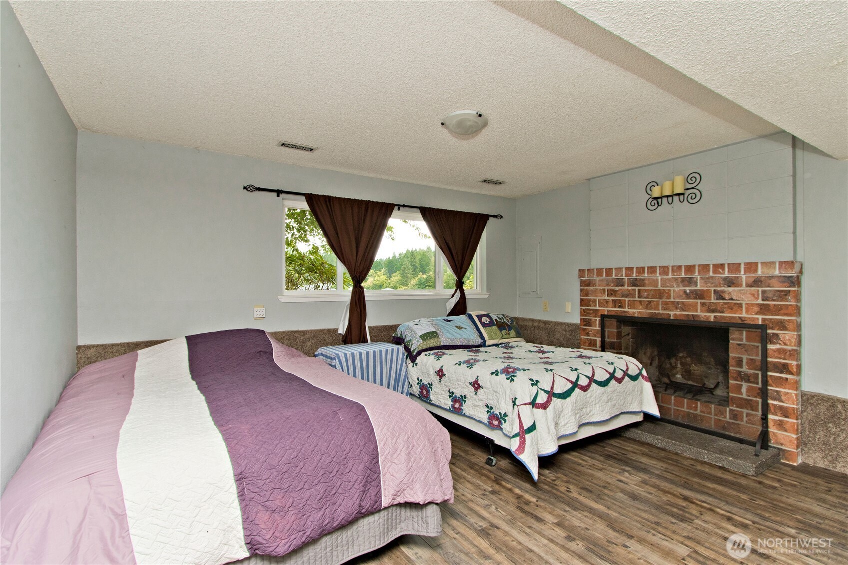4237 South 326th Place Federal Way, WA 98001 - Photo 15 of 24 a bedroom with bed and a fireplace