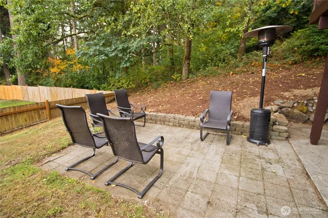 a balcony with wooden floor and fence