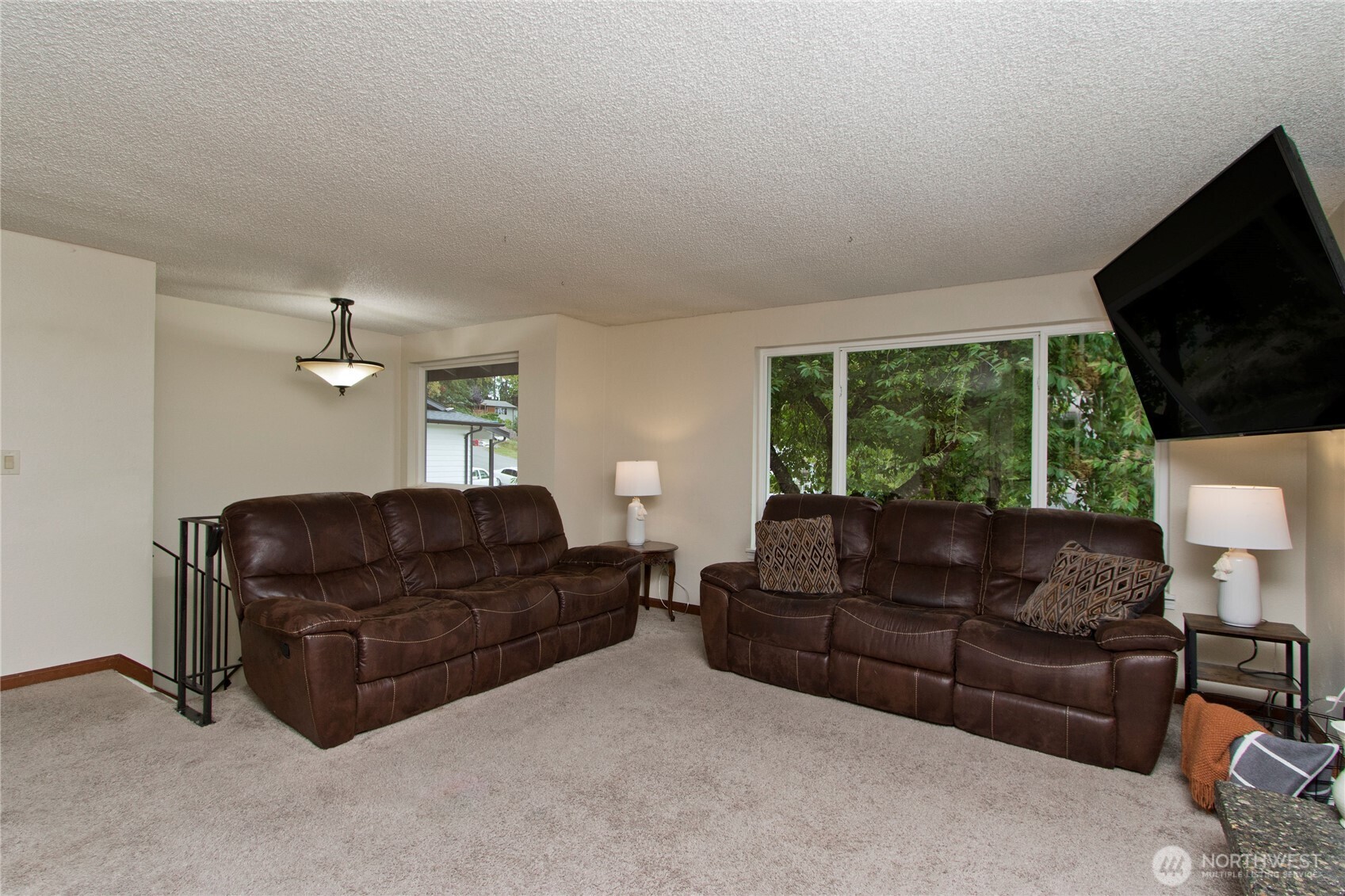 4237 South 326th Place Federal Way, WA 98001 - Photo 7 of 24 a living room with furniture a flat screen tv and a large window