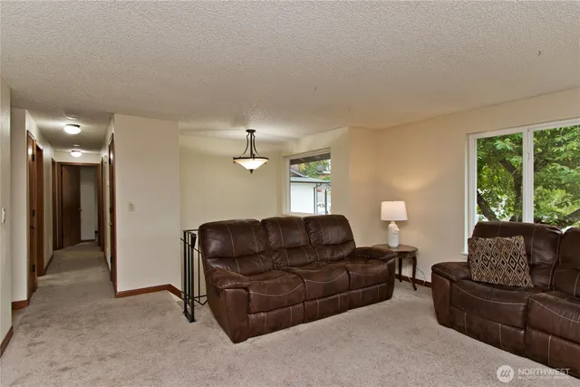 a bathroom with a sink a mirror a toilet and vanity