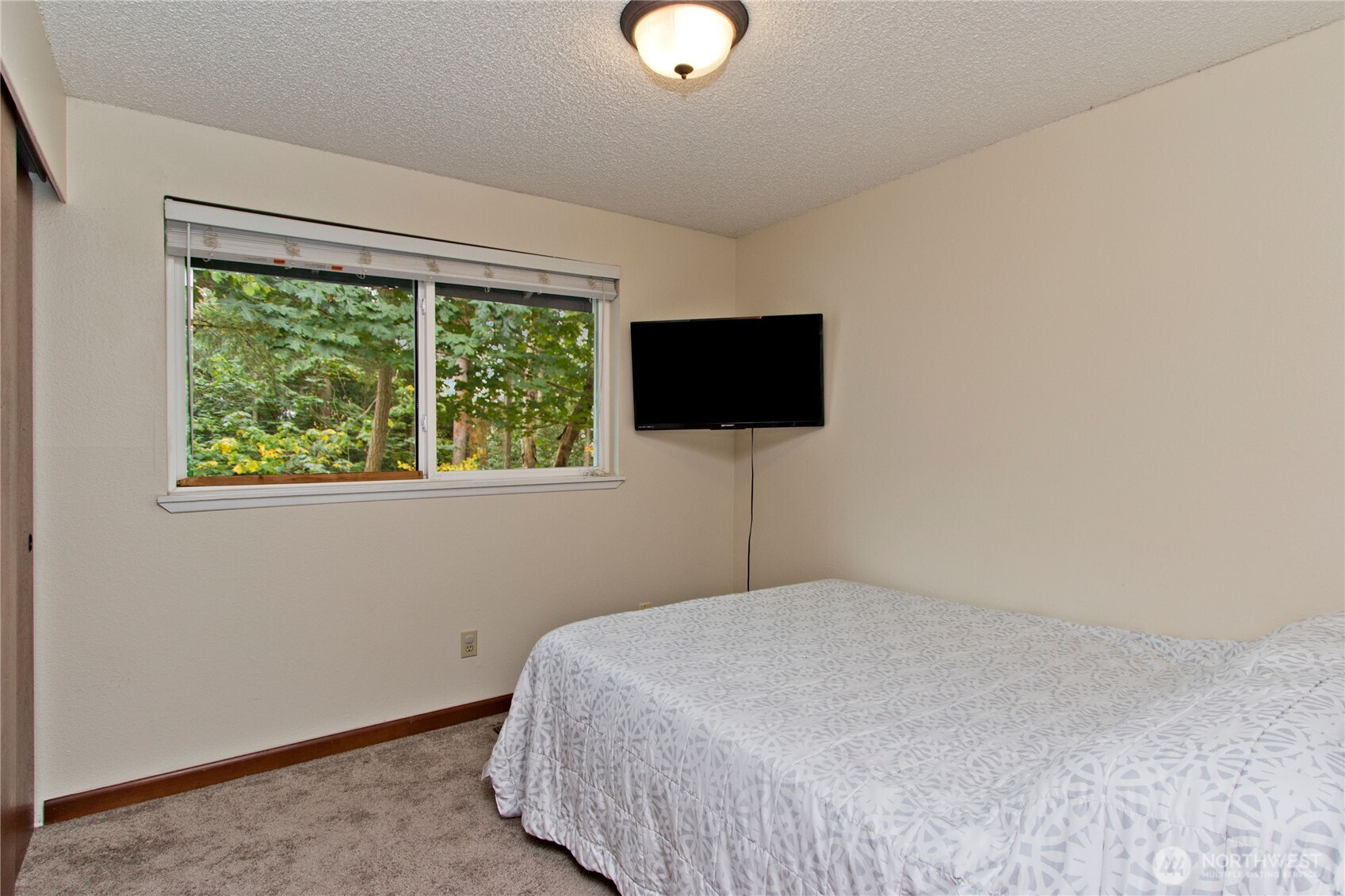 4237 South 326th Place Federal Way, WA 98001 - Photo 10 of 24 a bedroom with a bed tv and a window