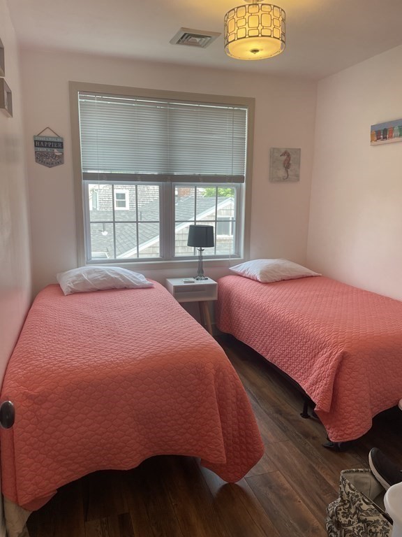 128 Colonial Road Marshfield, MA 02050 - Photo 16 of 21 a bedroom with two beds and a window