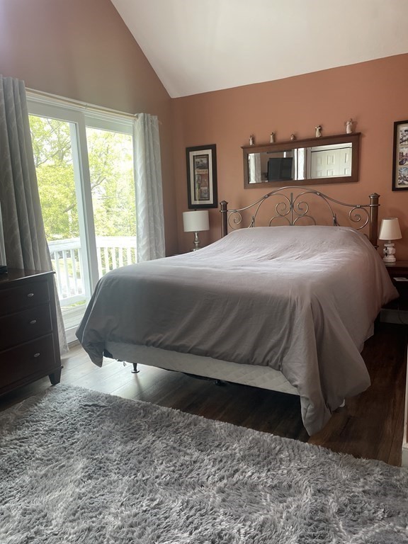 128 Colonial Road Marshfield, MA 02050 - Photo 17 of 21 a bedroom with a bed and wooden floor