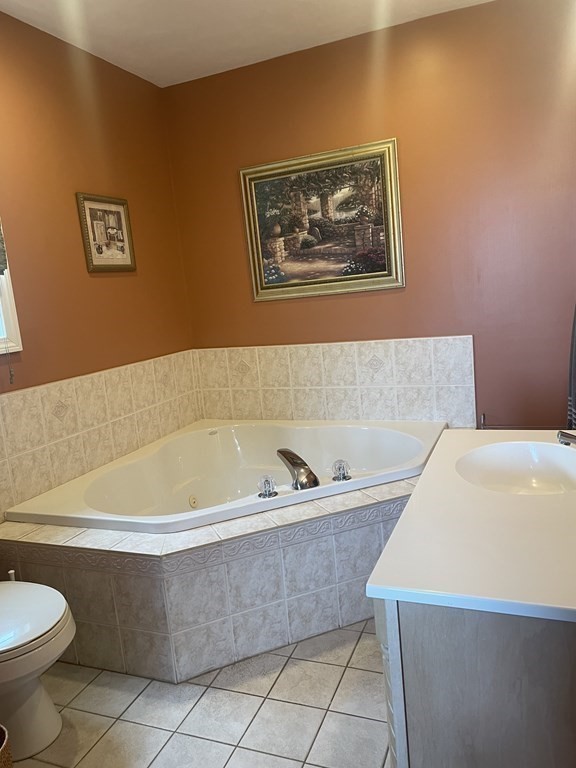 128 Colonial Road Marshfield, MA 02050 - Photo 18 of 21 a bathroom with a bathtub and a toilet