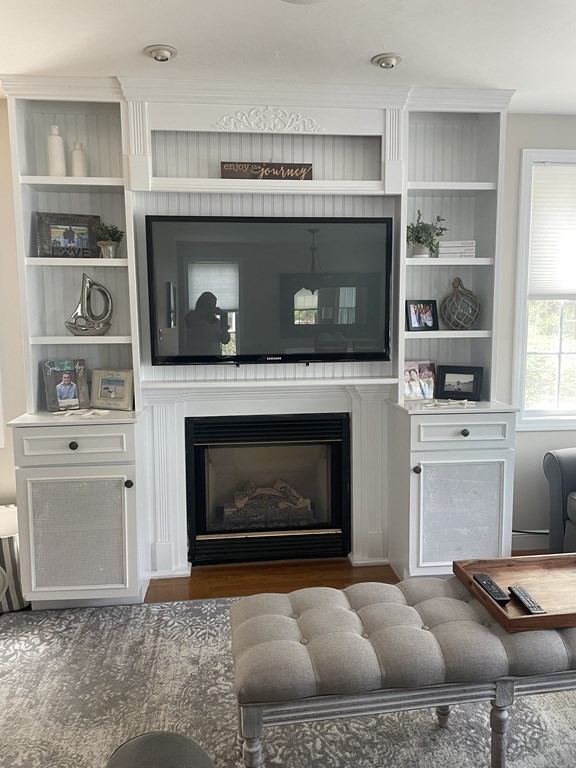 128 Colonial Road Marshfield, MA 02050 - Photo 4 of 21 a living room with furniture and a fireplace