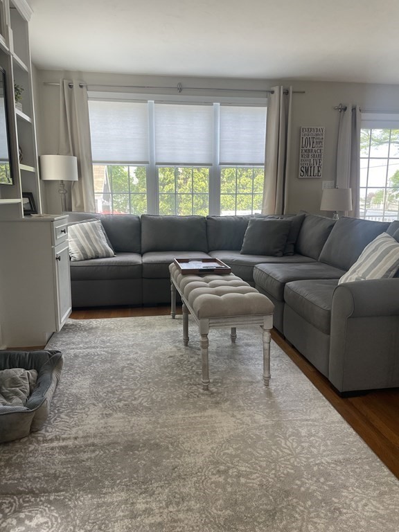 128 Colonial Road Marshfield, MA 02050 - Photo 5 of 21 a living room with furniture and a large window