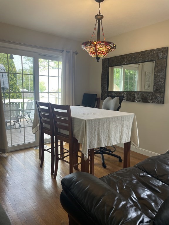 128 Colonial Road Marshfield, MA 02050 - Photo 10 of 21 a bedroom with a bed and a chandelier