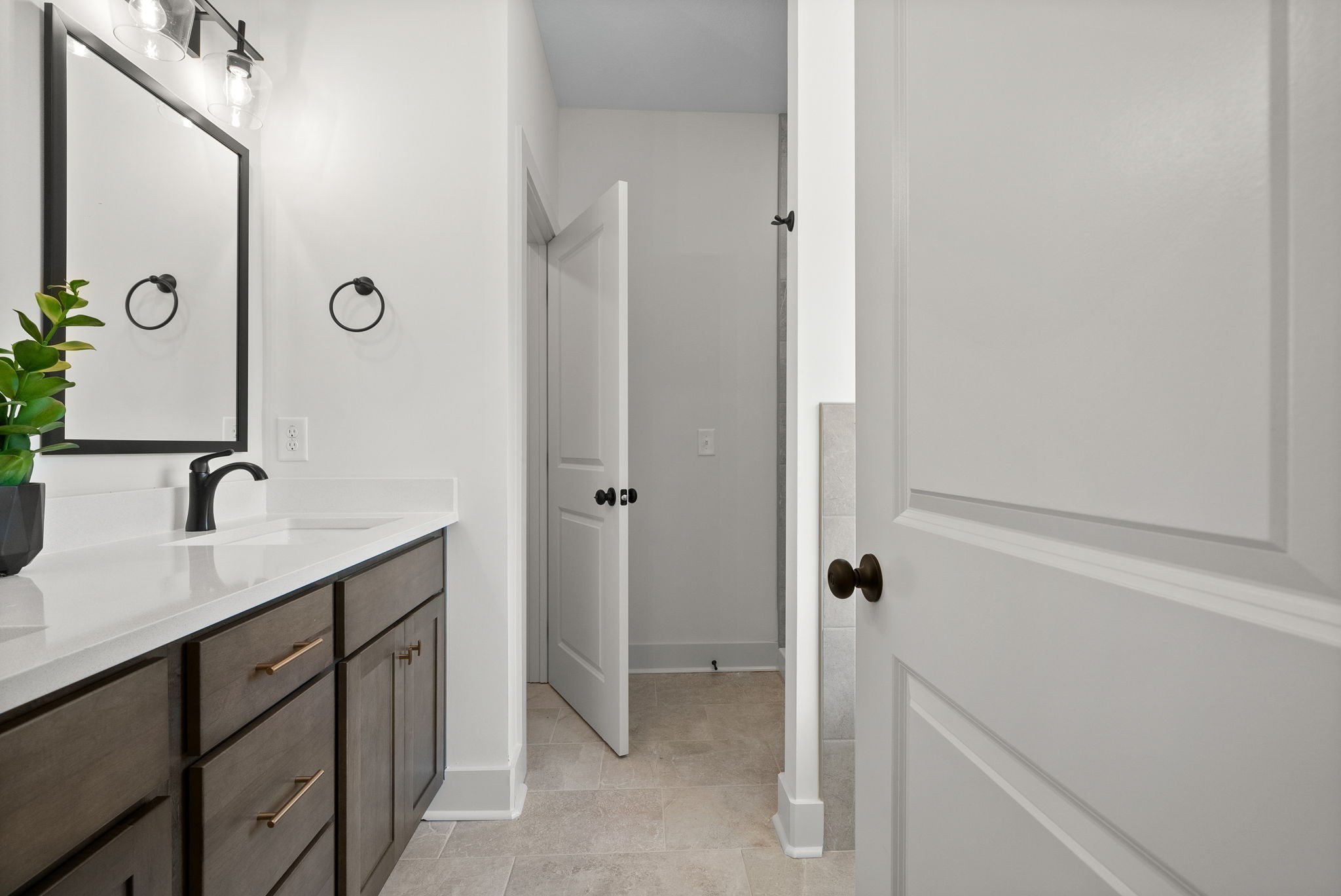 185 Dewberry Road Clarksville, TN 37042 - Photo 27 of 75 a bathroom with a granite countertop sink a mirror and a shower