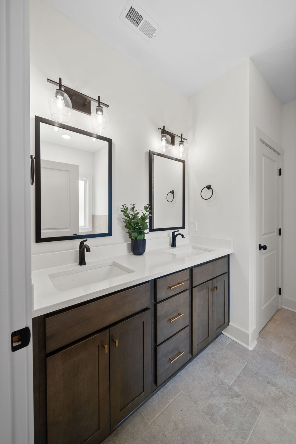 185 Dewberry Road Clarksville, TN 37042 - Photo 68 of 75 a bathroom with double vanity sinks and a mirror