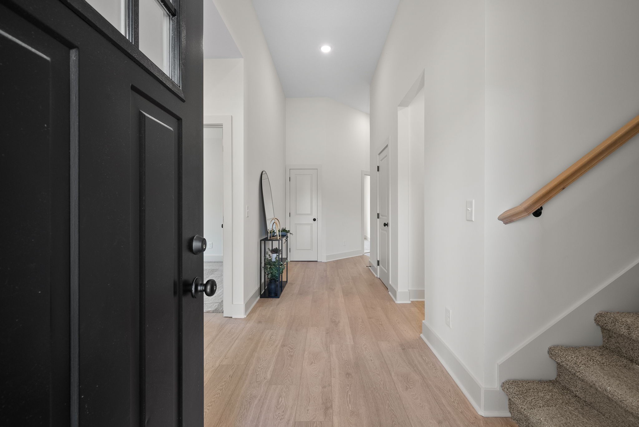 185 Dewberry Road Clarksville, TN 37042 - Photo 8 of 75 a view of a hallway with wooden floor and a living room