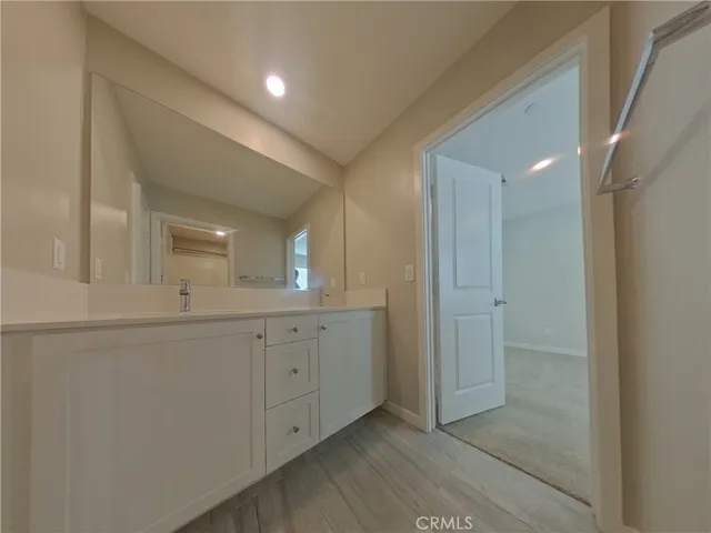 a bathroom with a double vanity sink and mirror