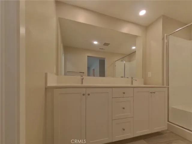 a view of a hallway to closet and utility room