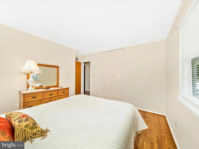 a view of bedroom with furniture and wooden floor
