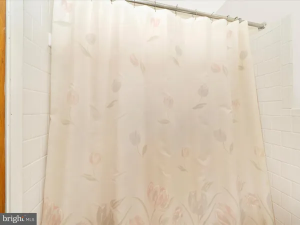 a bathroom with a shower curtain