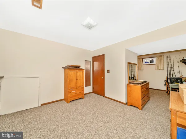 an empty room with furniture and closet