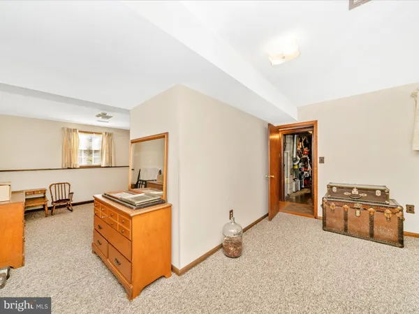 a view of a livingroom with wooden floor and a window