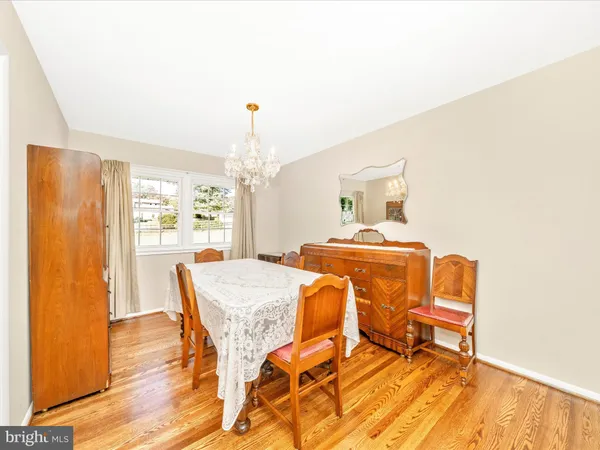a dining room with a table and chairs