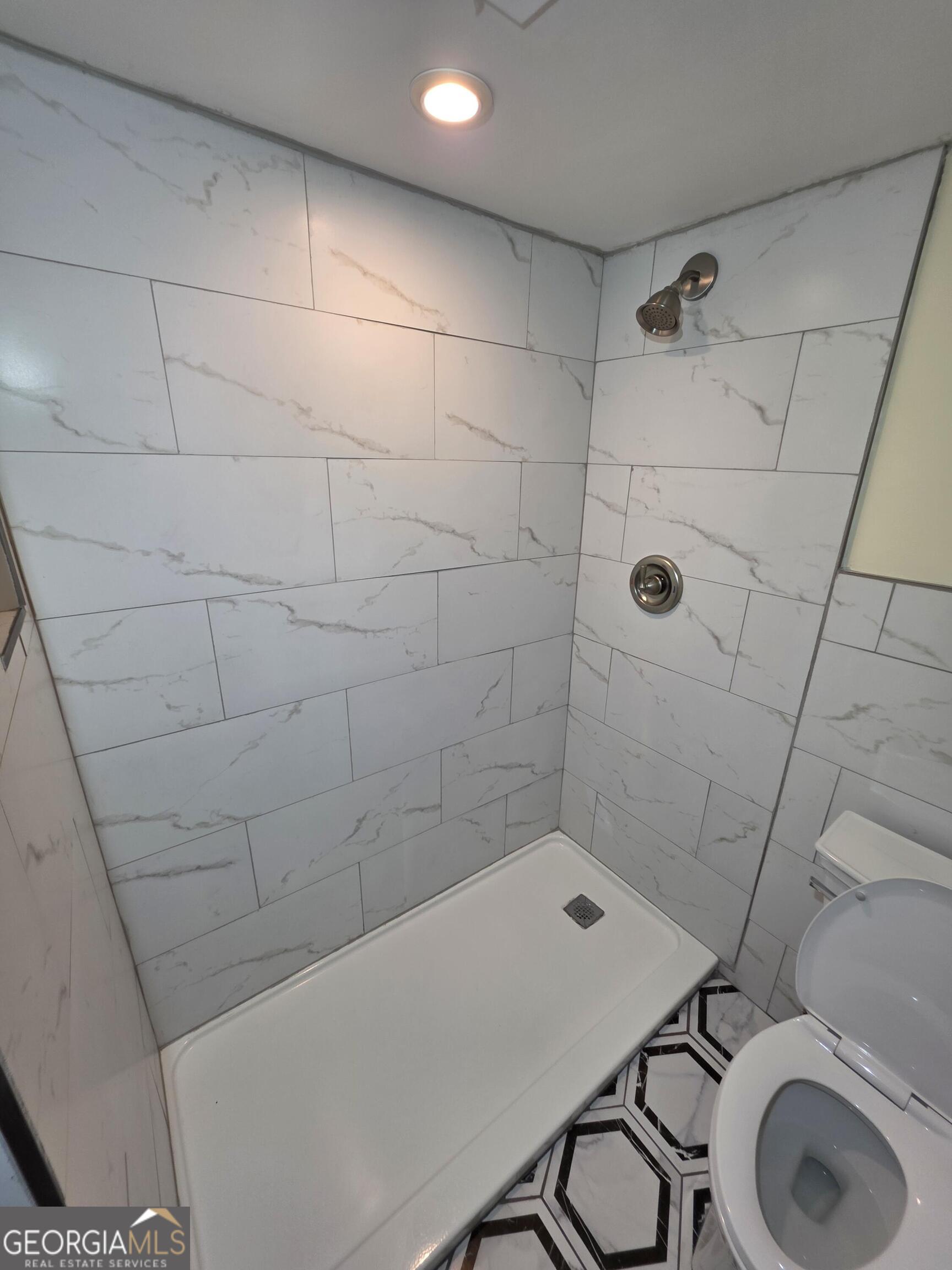 123 Elysian Way Northwest Atlanta, GA 30327 - Photo 12 of 18 a bathroom with a shower and a sink