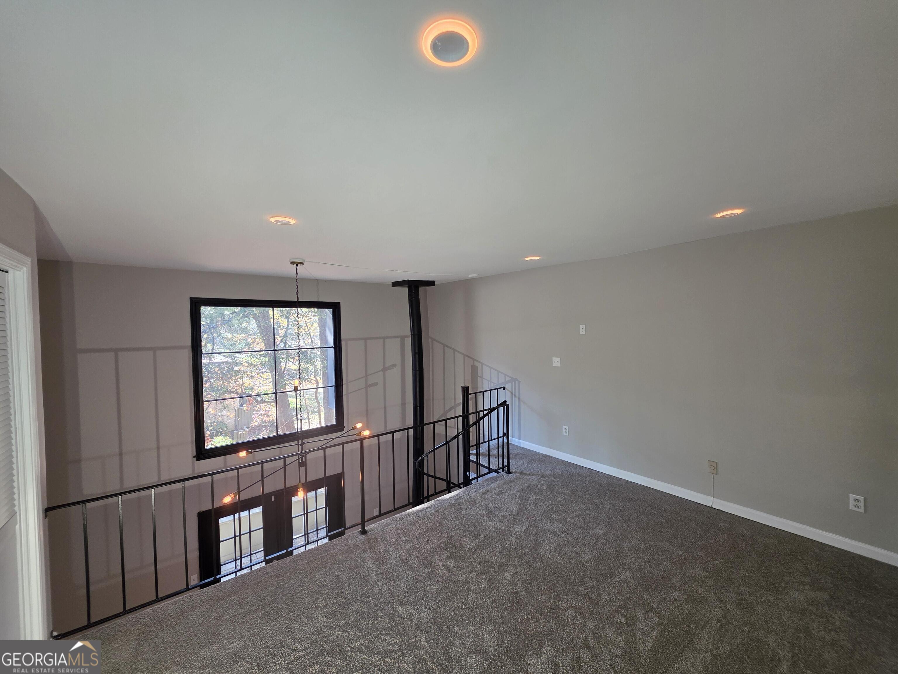 123 Elysian Way Northwest Atlanta, GA 30327 - Photo 17 of 18 a view of an empty room with a window